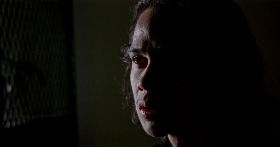 A man sitting in a room looking sad
