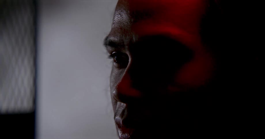 An image of a man sitting in a room