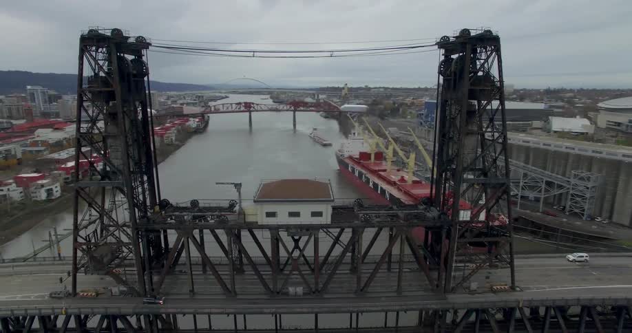 Aerial view of a bridge with cars driving over