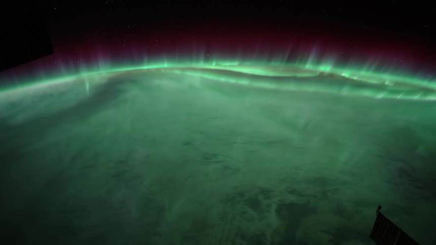 The planet earth with its atmosphere with space and stars in the background