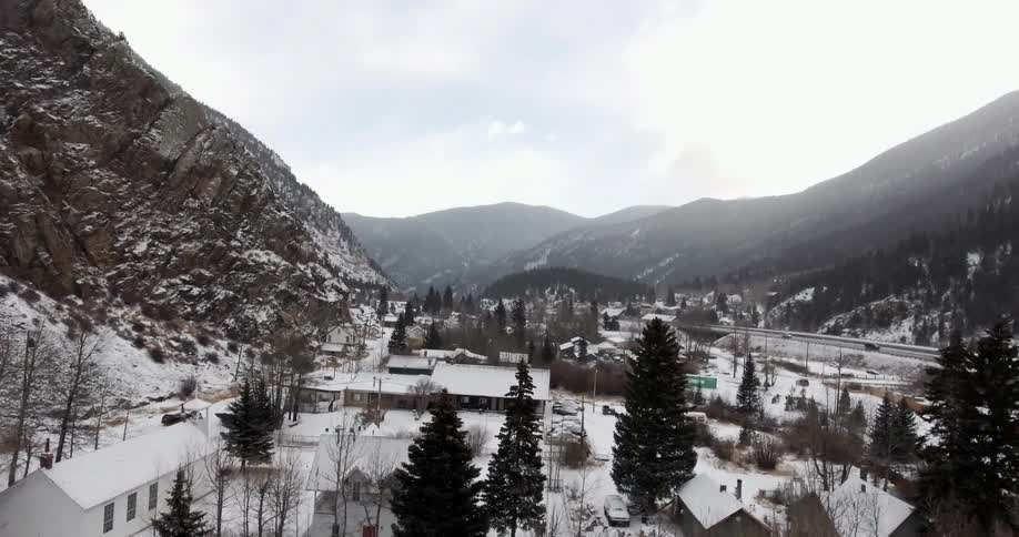Aerial view of a town sitting between two mountains
