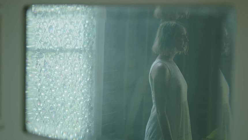 A woman standing up in a room