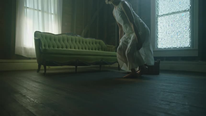 A woman getting up from the floor