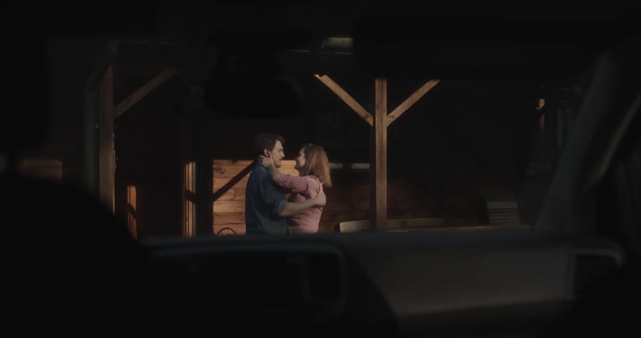 A man and woman running to hug and kiss each other