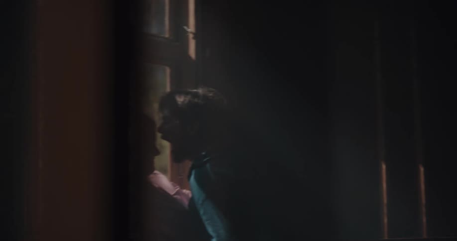 Young couple kissing and hugging in a cabin at morning