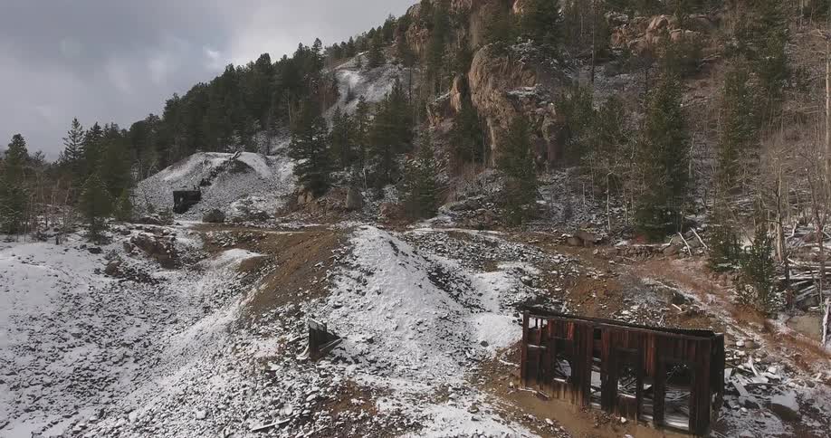 A burned out building sits on a mountain