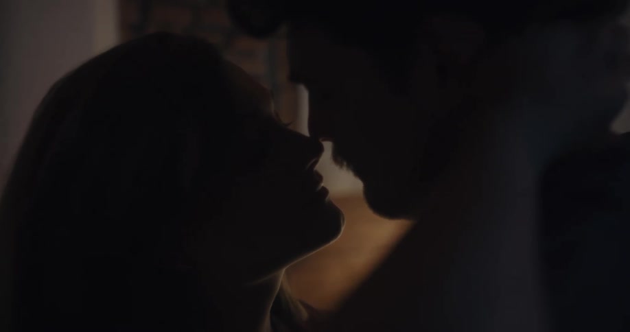 A couple make out in the small room