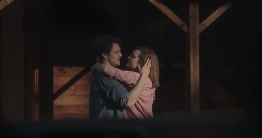 Woman runs out of house to greet man with hug and kiss