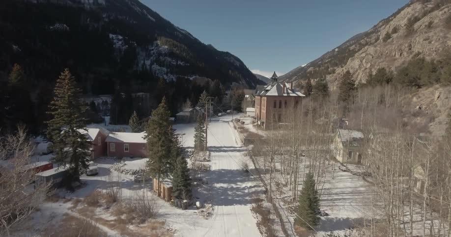 A village with snow on the ground on a winter day