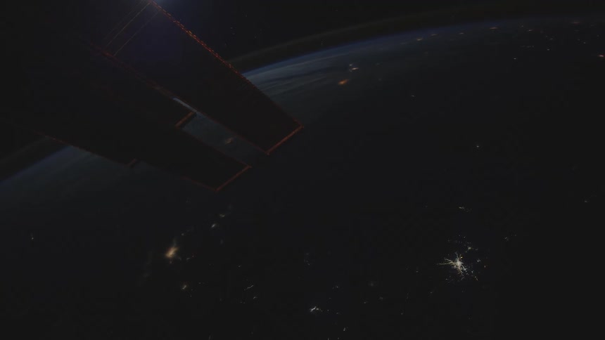 The surface of the planet earth can be seen at night from a satellite in outer space