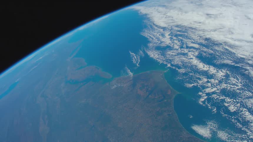 The curve of the blue earth against the black of outer space