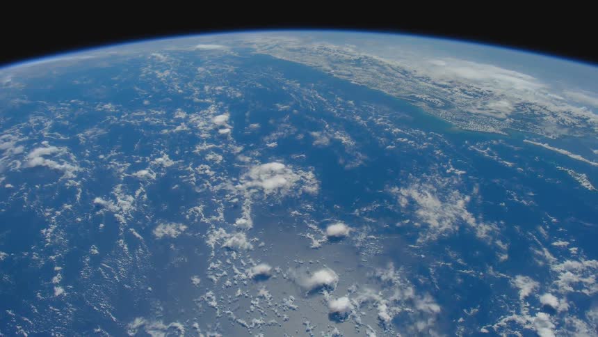 The atmosphere of earth over a coastal landscape as seen from space