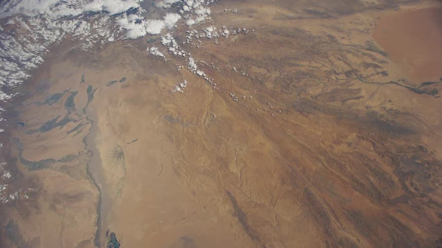 The surface and landscape of earth can be seen from a space station in outer space