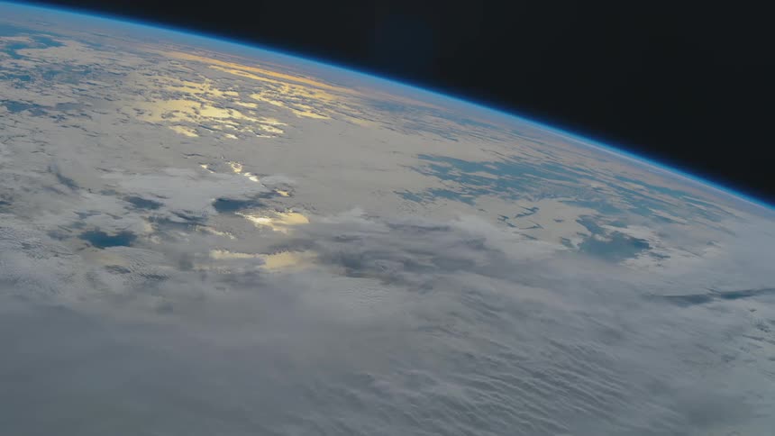 A view of earth from space with many clouds in the air