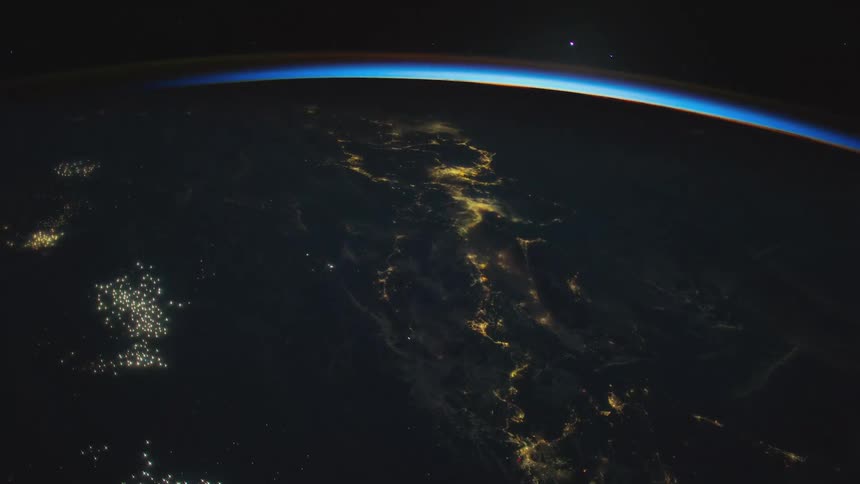 The planet earth with lights and atmosphere with space in the background