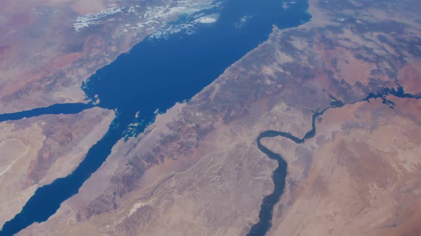 Coastline of oceans and rivers on the desert seen from space