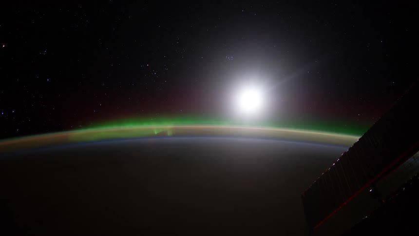 The surface and atmosphere of the planet earth can be seen at night from a satellite in outer space