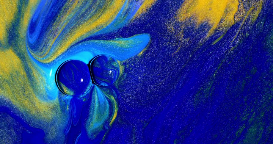 An abstract footage of a blue and yellow liquid