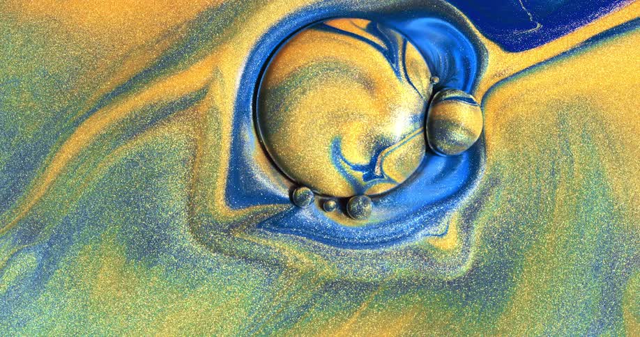 Yellow and blue colors moving like liquid and forming balls
