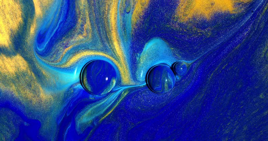A blue sphere flows and attaches itself to another in a swirl of blue and yellow