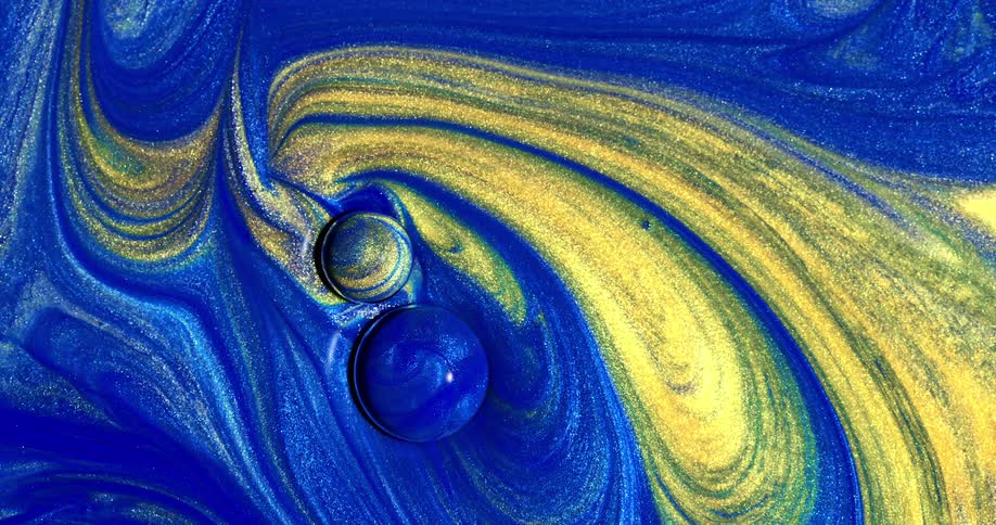 An abstract footage of blue and yellow paint