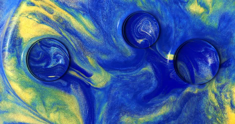 Blue and yellow sparkly paint blend around three circles