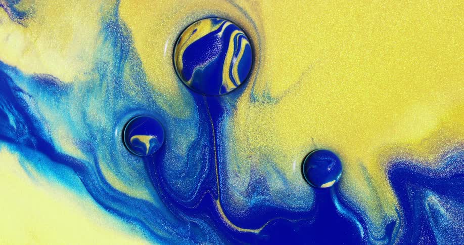 Three yellow and blue balls with yellow and blue colors moving downwards