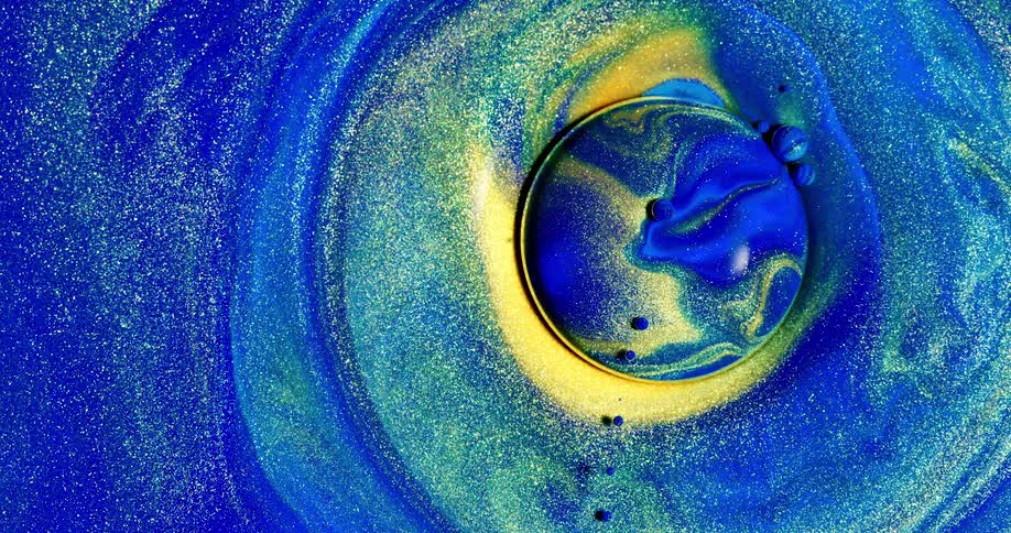 Colorful liquids bubble and mix