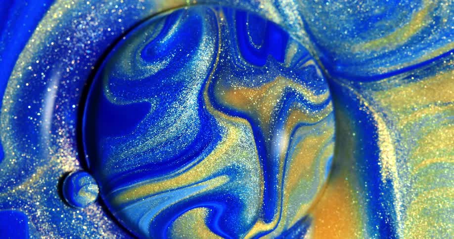 Two balls with yellow blue and gold colors moving