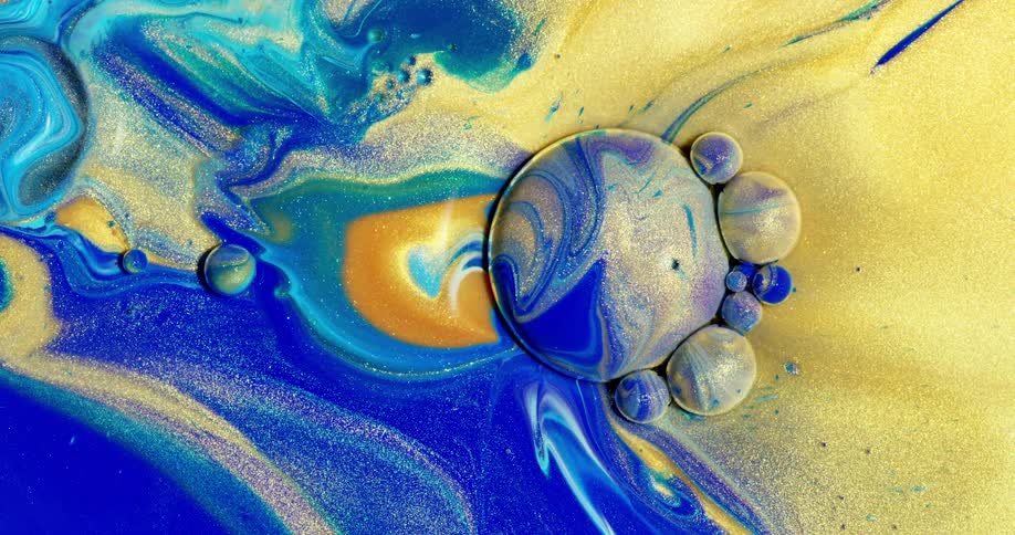 Colored liquid of various colors blend and mix together