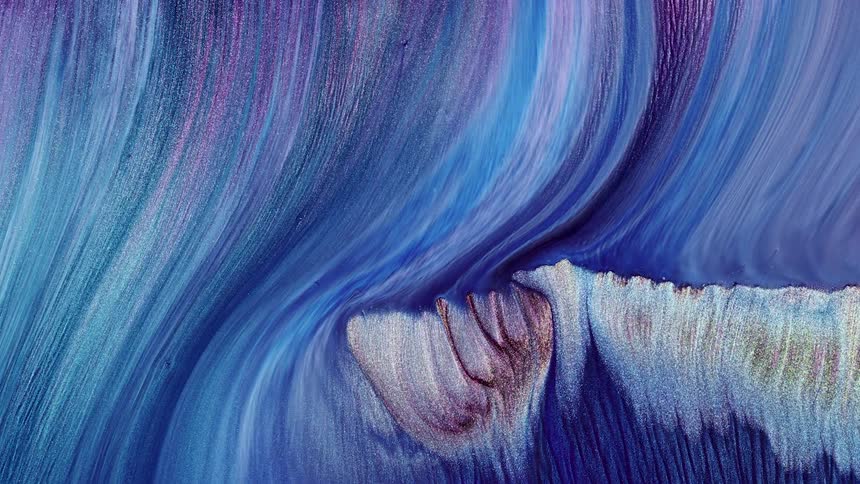 A blue and purple liquid running down a surface