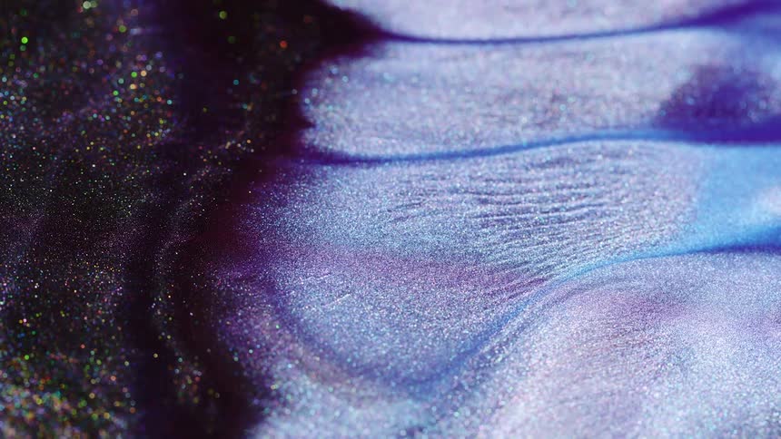 White purple yellow and blue colors move like flowing sand