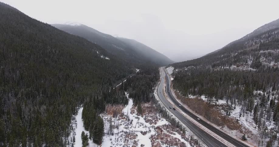 Aerial view of a road with cars traveling past