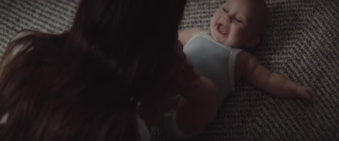 A mother and daughter playing on the floor