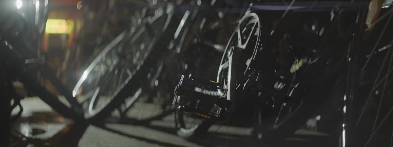 Close up of wheels and gears on bicycles