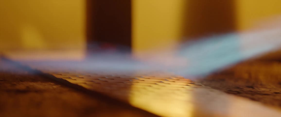 A person is using a torch on a piece of metal