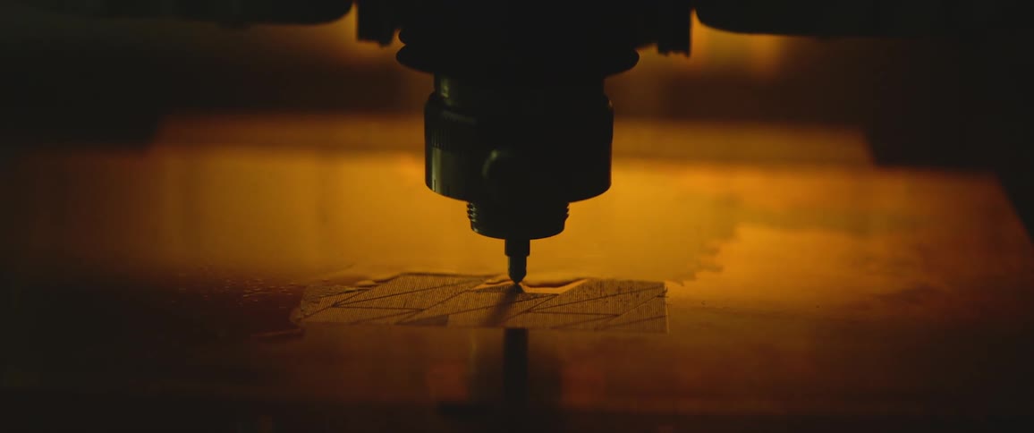 A machine is carving into the material