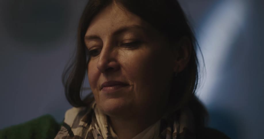 A close up of a woman as she keeps moving her arm forwards