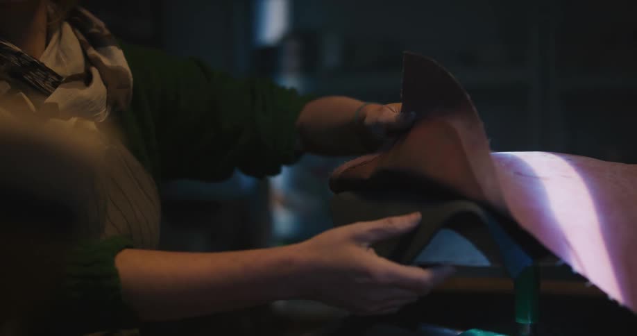 A person pulls fabric from the dome