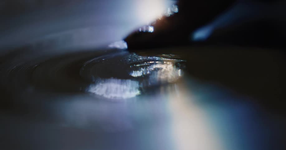 A view of a paint brush on a rotating disc