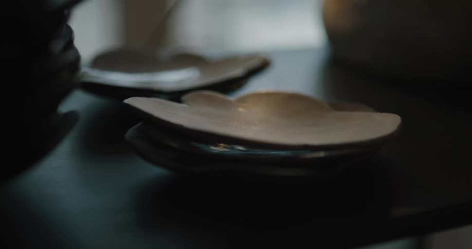 Pottery sitting on a table in front of a person