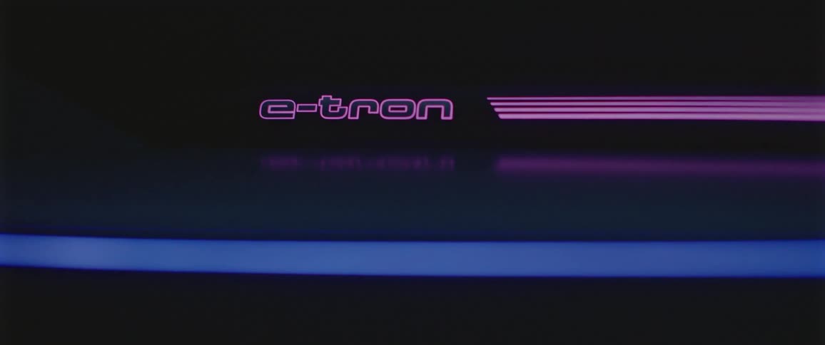 A vehicle with lights and a logo