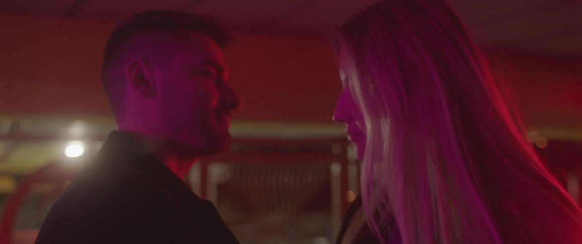 Man and woman are standing in a building together