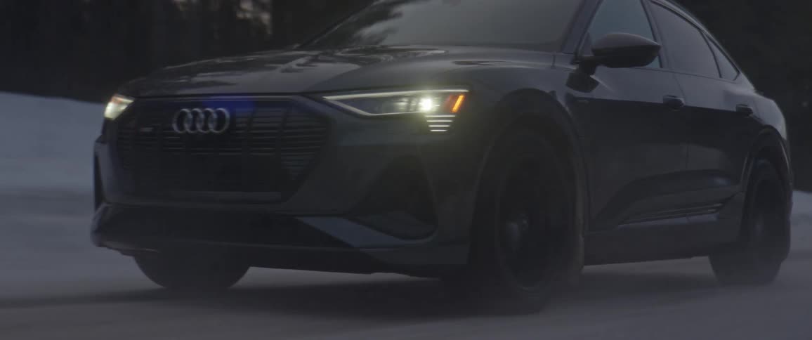 A car is driving outdoors in winter