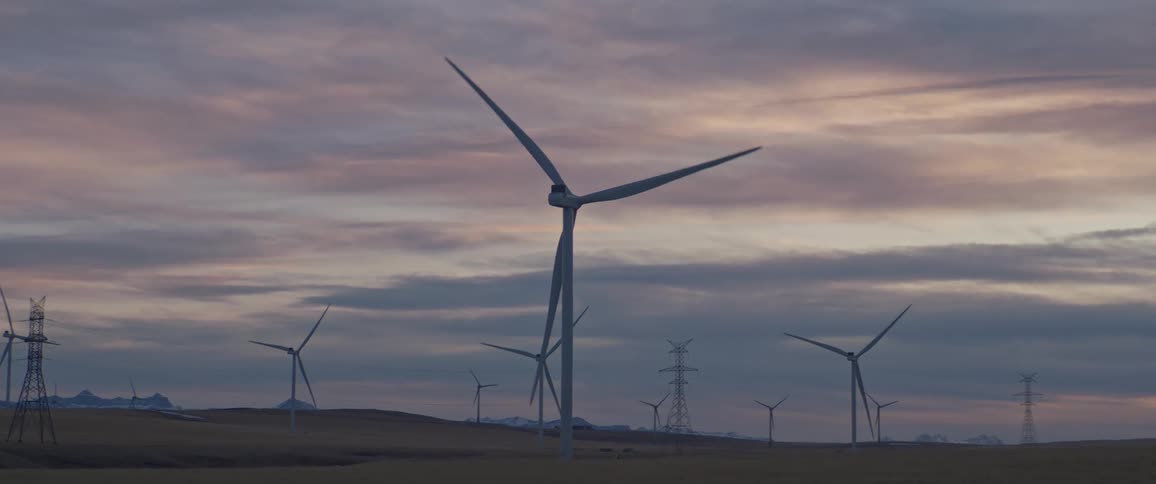 Turbines spinning on a wind farm on a cloudy day