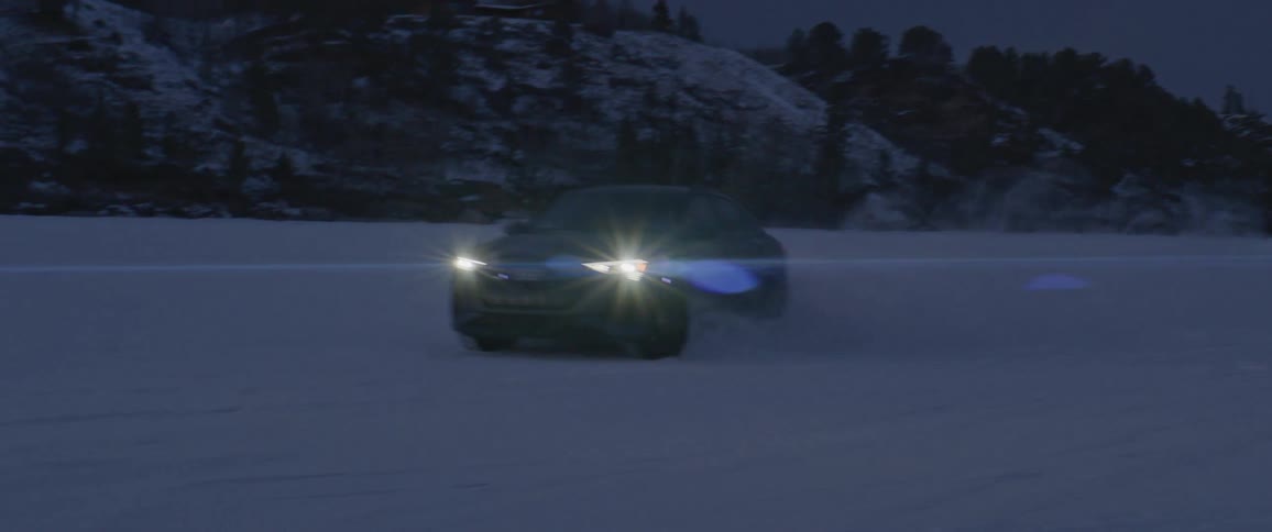 A car that is driving over a snowy area