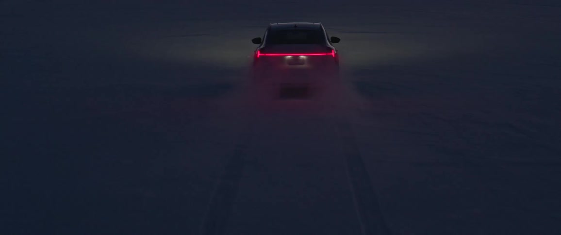 A vehicle driving on a snowy field