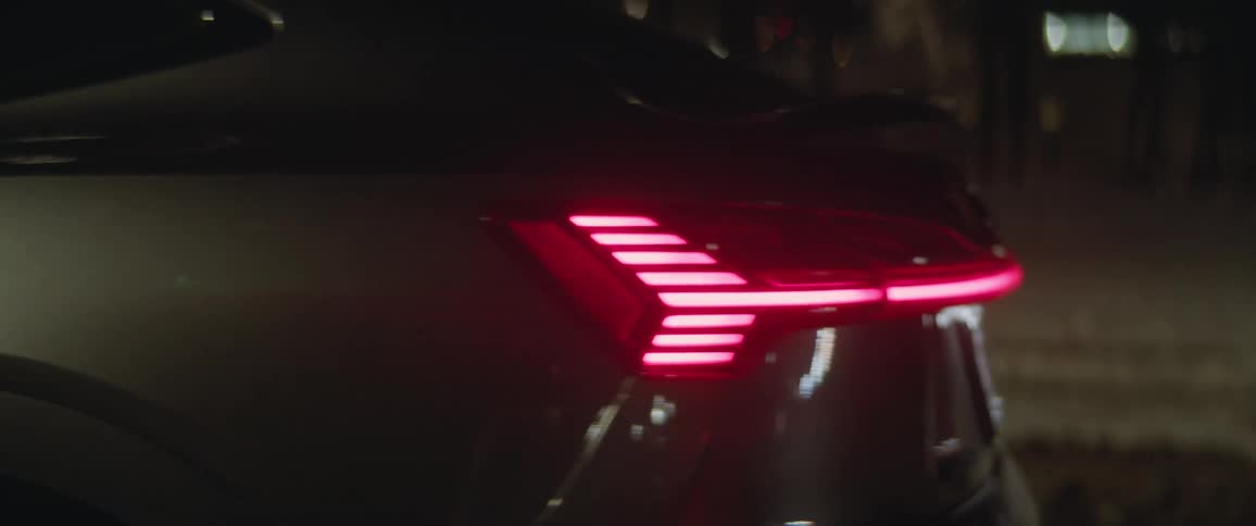 Dark grey audi cars rear lamps indicate left