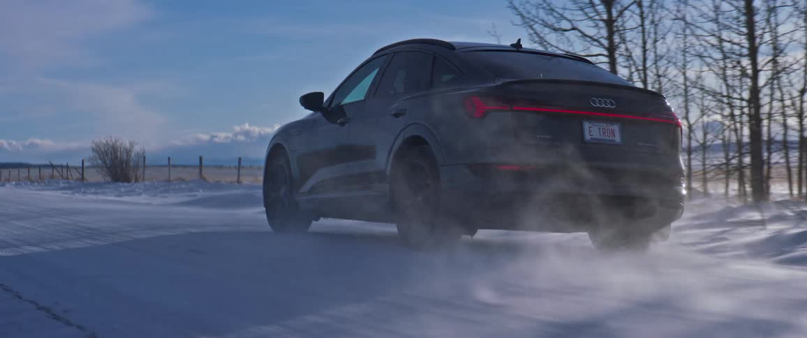 A car driving through the snow outdoors