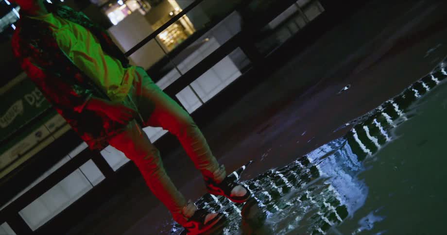 Dancer rehearses on a rooftop with the city skyline in background